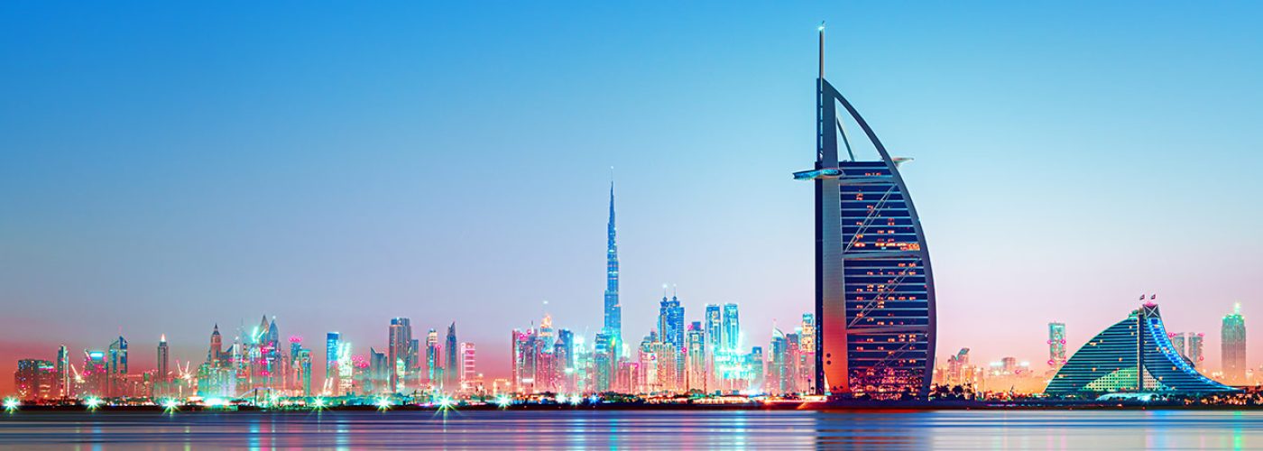 Dubai - amazing city center skyline and famous Jumeirah beach at sunset, United Arab Emirates